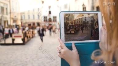 爱沙尼亚塔林，妇女用触摸板拍摄古街的特写镜头